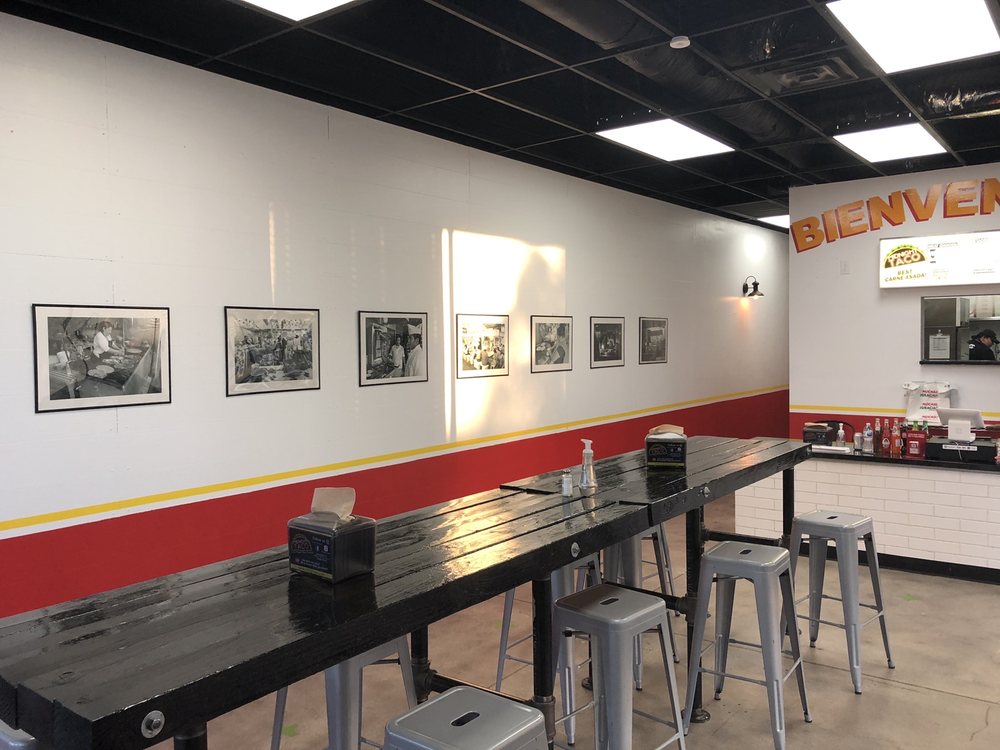 Inside Midnight Taco — taco-stand photos on the wall